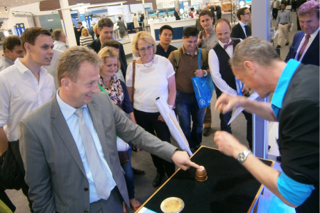 A crowd puller - the shell game at the fair's magic